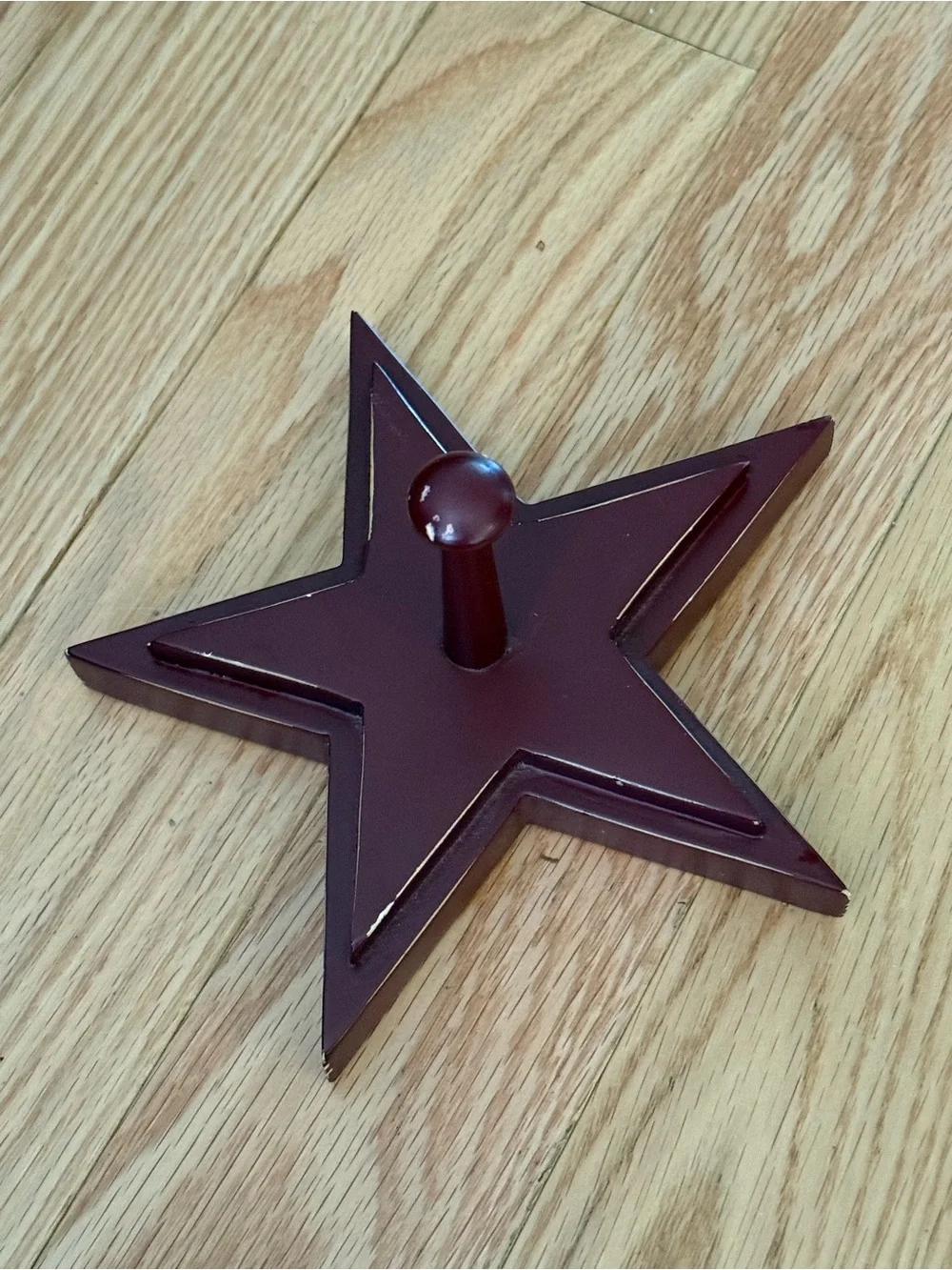 Pottery Barn distressed star shaped wall hooks maroon color 7”